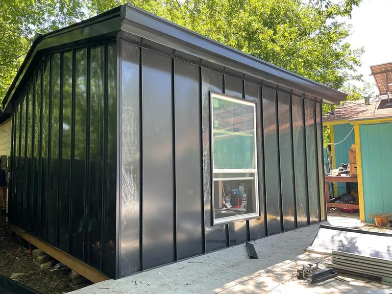 Black standing seam metal wall panels for Roof Inspection in East Greenwich